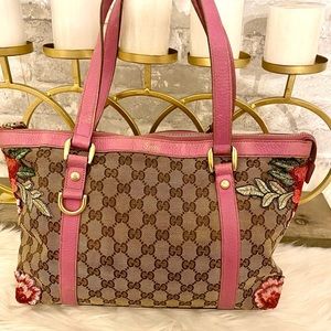 Authentic Gucci tote with customized patches.
